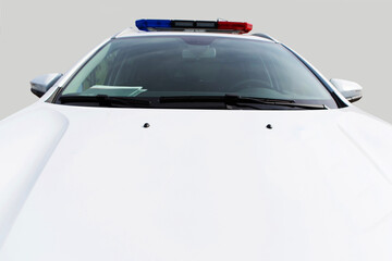 The hood of a white police car. Law enforcement vehicle with flashing beacons. Copy space....