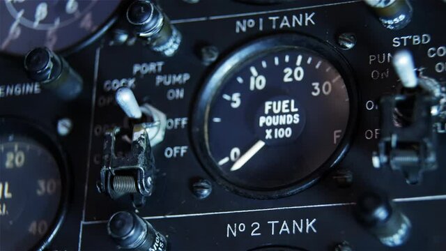 Old Plane Cockpit, Fuel Gauge and Knobs in an Old Aircraft. Close Up. 4K Resolution.