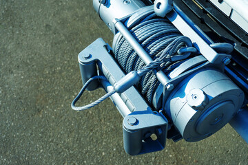 Large truck winch with heavy duty metal cable. Close-up