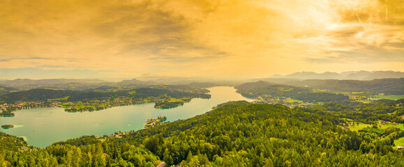 Fototapeta na wymiar Aerial view of the alpine lake Worthersee, famous tourist attraction for many water activity in Klagenfurt, Carinthia, Austria.