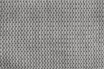 Grey knitted fabric texture as a background