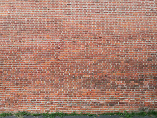 red background - a picture of the brick wall of the old Kremlin fortress in Nizhny Novgorod, Russia