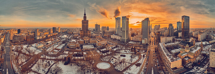 Beautiful panoramic aerial drone view on All Saints Church - Roman Catholic church located at Grzybowski Square, Warsaw City Skyscrapers, PKiN, and Varso Tower under construction. Warsaw, Poland - obrazy, fototapety, plakaty