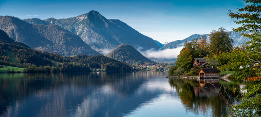 Naklejka na ściany i meble Autumn morning with patches of fog on the lake Grundlsee, Styria, Austria.