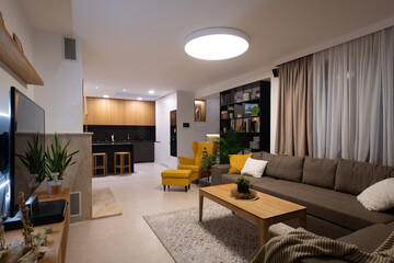 Interior of living-room connected with kitchen in a modern house