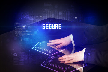 Hand touching digital table with SECURE inscription, new age security concept