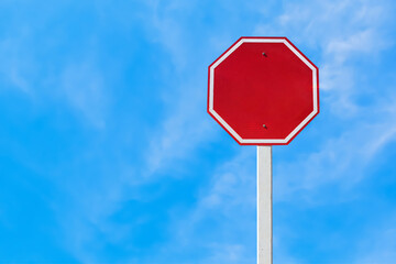 Isolated blank red traffic sign on pole with clipping paths.