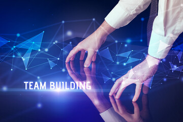 Businessman touching huge screen with TEAM BUILDING inscription, modern technology business concept