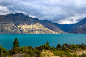 Fototapeta na wymiar Lake Wakatipu on a cloudy day, Queenstown, New Zealand