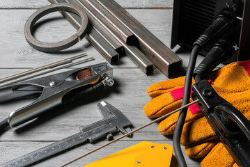 Welding concept background. Metal pieces, welding terminals, magnet holder, electrodes and welding...
