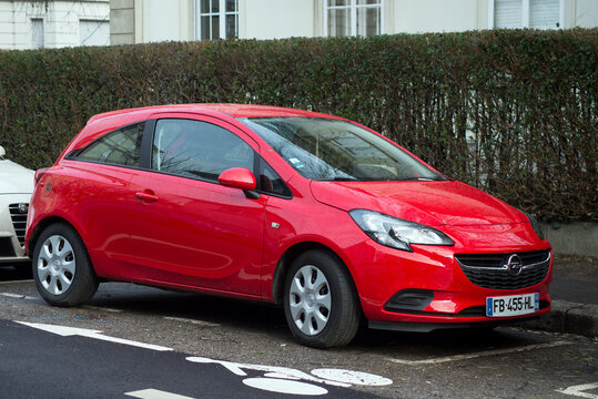 Mulhouse - France - 23 January 2021 - Front view of red Opel Corsa parked in the street, Opel is the popular brand of german cars