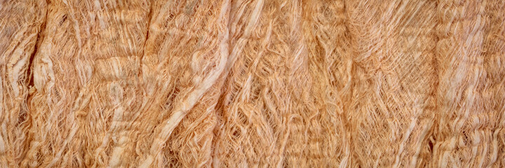 raw, natural mulberry paper handmade in Thailand - background and texture of fibers, panoramic banner