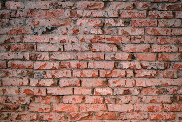 Old rough brick wall texture background front view.