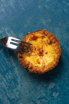 Fresh Egg Custard Tart From Above With Cake Fork