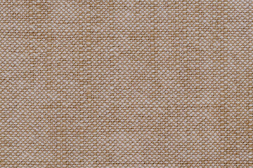 A weave pattern of white-beige fibres fabric. Textile texture as a background