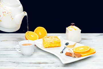 Hot tea with a mug spoon oops orange slices and sugar. Cozy home tea concept
