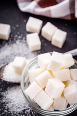 sugar refined on a dark stone background