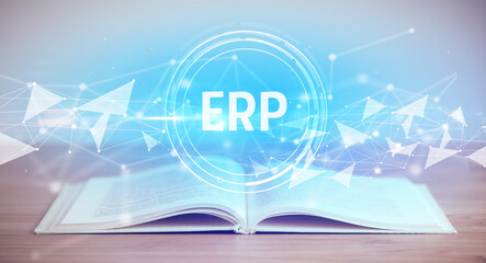 Open book with ERP abbreviation, modern technology concept