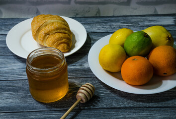 Still life with fresh fruits and glass of juice on the wooden background