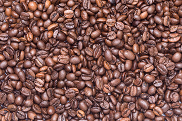 Full frame of roasted coffee beans (seeds), top view
