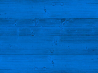 Fototapeta premium Top view of blue background wooden planks board texture.