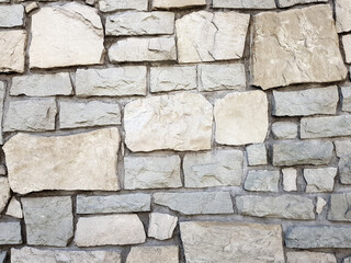 Old bright white pattern stone wall texture.