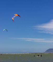yung kitesurfers with teachers during lesson at Tahunanui Beach at Nelson, New Zealand