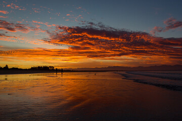 Fototapeta na wymiar beach in nelson during a breathtaking sunset on Tahunanui Beach at Nelson, New Zealand