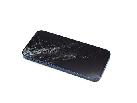Photo of blue smartphone with broken damaged display. Modern smartphone with damaged glass screen on white background. Device needs repair.