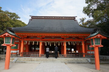 People praying at Pavilion or main Hall of Sumiyoshi jinja or Shrine in Kyushu, Fukuoka prefecture, Japan - 住吉神社 御本殿 国指定重要文化財 福岡 九州 日本