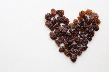 Heart of dark raisins. Background.