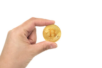 Bitcoin in a female hand isolated on a white background. Investment concept.