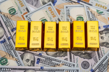 gold bars on 100 new US dollar banknotes.