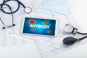 Close-up view of a tablet pc with ANTIBODY inscription, microbiology concept