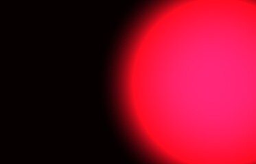 Red spot on a black background.