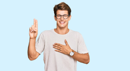 Handsome caucasian man wearing casual clothes and glasses smiling swearing with hand on chest and...