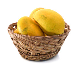 closeup ripe mangoes in basket