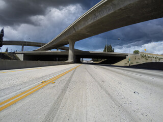 Driving towards storm clouds on the 118 freeway in Los Angeles California.