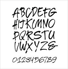 Vector Acrylic Brush Style Hand Drawn Alphabet Font. Calligraphy alphabet and numbers on a black background. Ink hand lettering.
