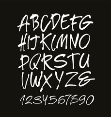 Vector Acrylic Brush Style Hand Drawn Alphabet Font. Calligraphy alphabet and numbers on a black background. Ink hand lettering.