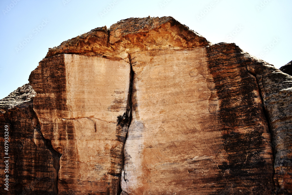 Canvas Prints Big brown rock with a crack on it during the daytime