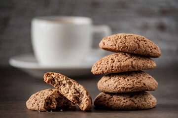 a cup of coffee with oatmeal cookies