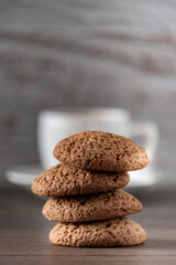 Fototapeta na wymiar a cup of coffee with oatmeal cookies