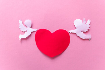 valentines day consept. red hearts and cupid on pink background. valentine's day card.