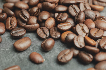 Medium roasted coffee beans on cement ground