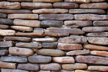The background is made of stones, cobblestones laid in rows on top of each other