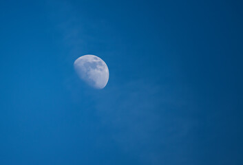 Naklejka na ściany i meble half moon in the sky at day time