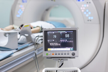Electrocardiogram in hospital CT Scan room. heart rate monitor in hospital. Process of CT scanning...