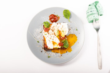 Dish and fork with ruler. Diet food and a fork with a ruler.