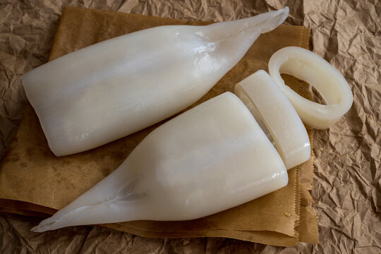 Peeled squid sliced ​​into rings on craft paper